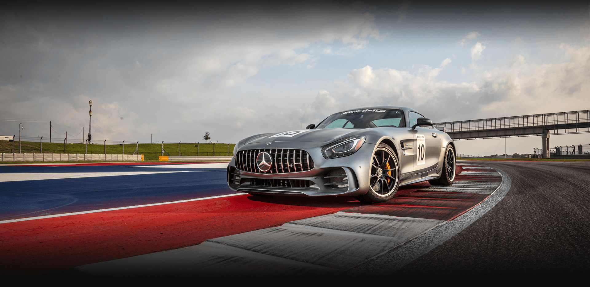 Gray Mercedes-AMG vehicle parked on rumble strip at Circuit of the Americas
